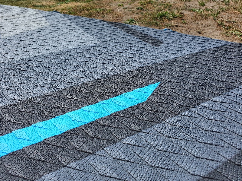 Close up of the crocodile textured deck pad on a Bluefin Cruise